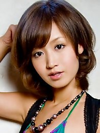 Soft breasted japan cutie on the rooftops in a pink bikini