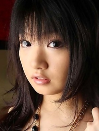 Cute Asian takes off her bikini top