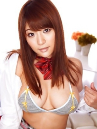 Meguri in short uniform skirt shows huge tits in small bra