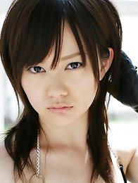 Sultry Akiko Seo showing off her curvy body in a leather bikini