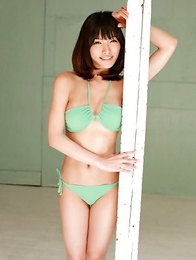 Anna Konno in green bath suit and heels is sexy and playful