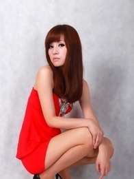 Sandy on heels shows hot behind in red dress for pictures