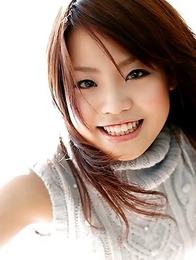 Nana Miyashita is smiling and undressing on the camera