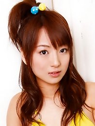 Sexy gravure idol babe in a short white lace skirt and stockings