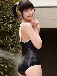 Miu Nakamura Asian in bath suit plays with water in her garden