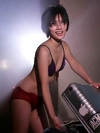 Mari Hoshino is a sexy glamour model posing in her minidress