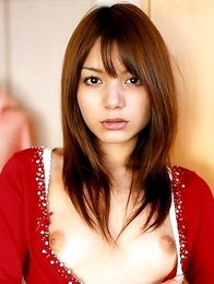 Tina Yuzuki is holding flowers in front her hairy pussy
