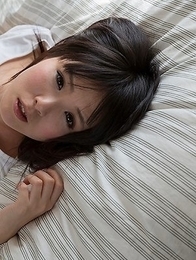 Hottie in white Sena Sakura shows off her perfect body on a big white bed