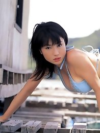 Nonami Takizawa lies on her stomach to show off her cleavage