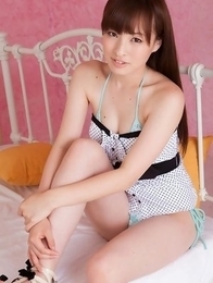 Maho Kiruma in cute outfit shows hot bum in bikini on bed