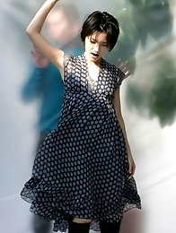 Mari Hoshino is a sexy glamour model posing in her minidress