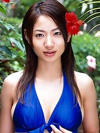 Alluring asian beauty with a perfect body in an orange bikini