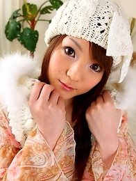 Hot babe Fuwari poses on the couch