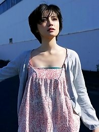 Mari Hoshino is a sexy glamour model posing in her minidress