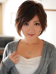 Kaede Oshiro with busy mouth shows sexy legs