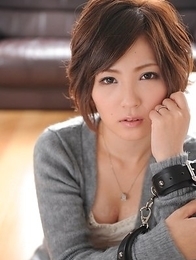 Kaede Oshiro with busy mouth shows sexy legs