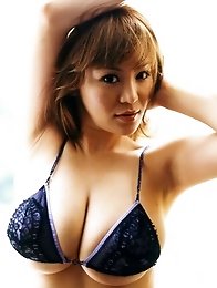 Beautiful asian babe with big boobs spilling from lace lingerie