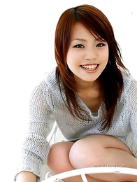 Nana Miyashita is smiling and undressing on the camera