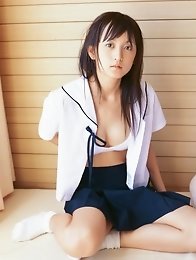Delicious petite gravure idol wearing red bikini bottoms