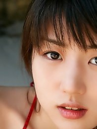 Cute gravure idol babe with perfect plump boobs in orange bikini