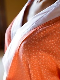 Lovely and tanned Japanese av idol Nami Hoshino shows her amazing naked body