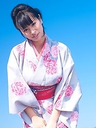 Asian big breasted Hana Haruna posing in a traditional japanese dress her huge tits!