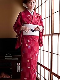 Yuna Asami wearing a beautiful traditional dress covering her big tits