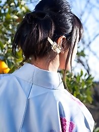 Asian big breasted Hana Haruna posing in a traditional japanese dress her huge tits!