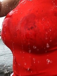 she takes off the shirt and goes swimming to the sea in a small bikini.