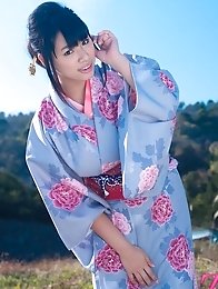 Asian big breasted Hana Haruna posing in a traditional japanese dress her huge tits!