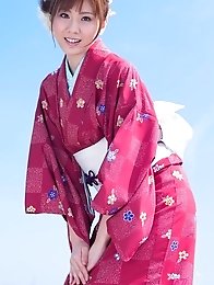 Yuna Asami wearing a beautiful traditional dress covering her big tits