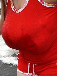 she takes off the shirt and goes swimming to the sea in a small bikini.