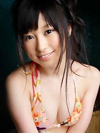 Beautiful pale skin asian goddess poses in her mint green bikini