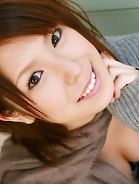 Hitomi Oda Asian shows nice cleavage on sweater and some of ass