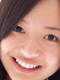 Mayumi Yamanaka smiles while undressing with erotic moves