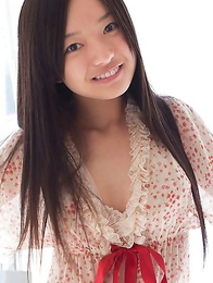 Mayumi Yamanaka smiles while undressing with erotic moves